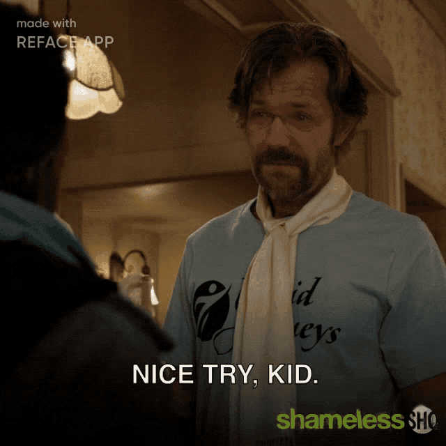 a man wearing a blue shirt that says nice try kid