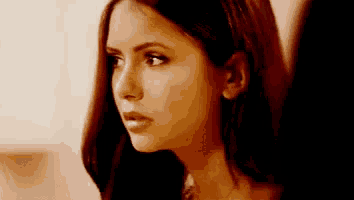 a close up of a woman 's face with her eyes closed and her mouth open .