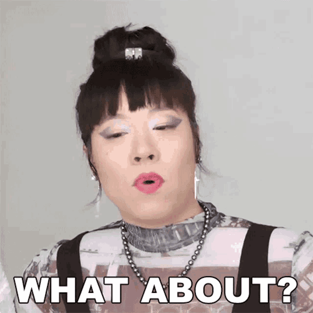 a woman is making a funny face and says what about