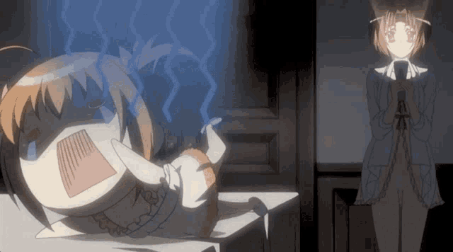 a girl laying on a bed with a surprised look on her face while another girl stands behind her