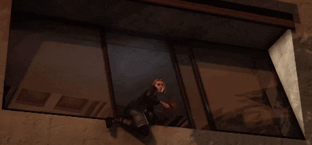 a man holding a gun in a dark room