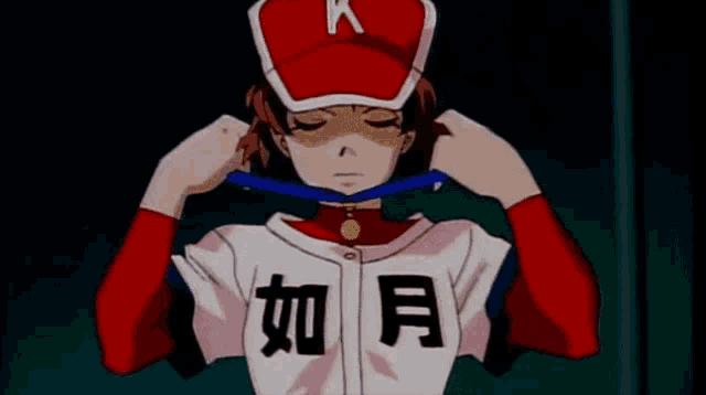 a person with chinese writing on their shirt and hat