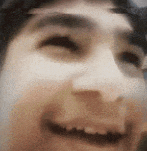 a close up of a man 's face with his eyes closed