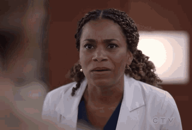 a woman in a lab coat with a ctv logo on the sleeve