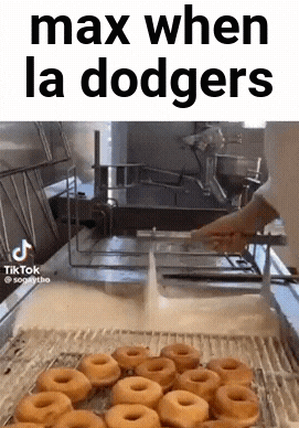 a bunch of donuts are being cooked in a fryer with the words max when la dodgers on the bottom
