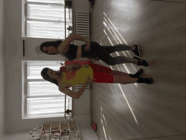 a woman wearing a yellow tank top that says zumba
