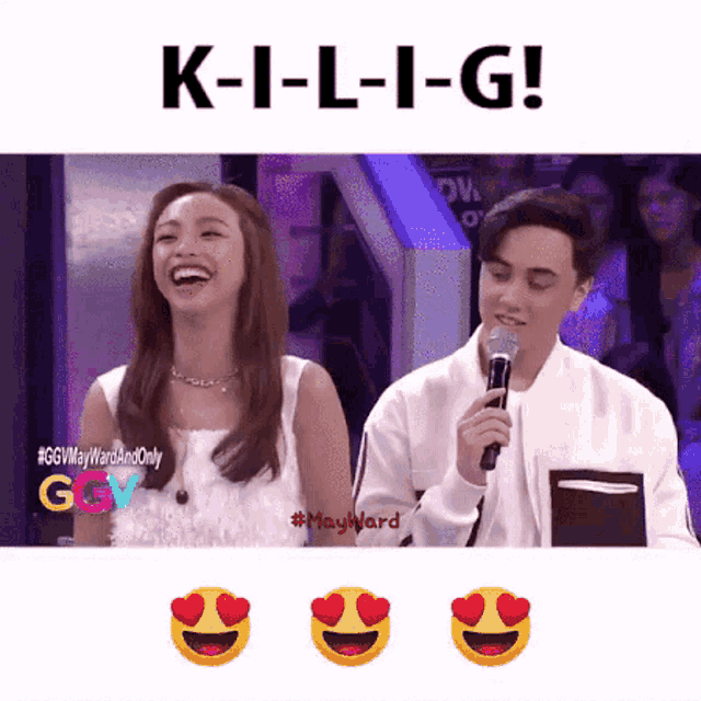 a man holding a microphone next to a woman laughing