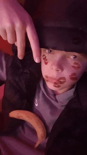 a person with lipstick on their face is wearing a nike sweatshirt