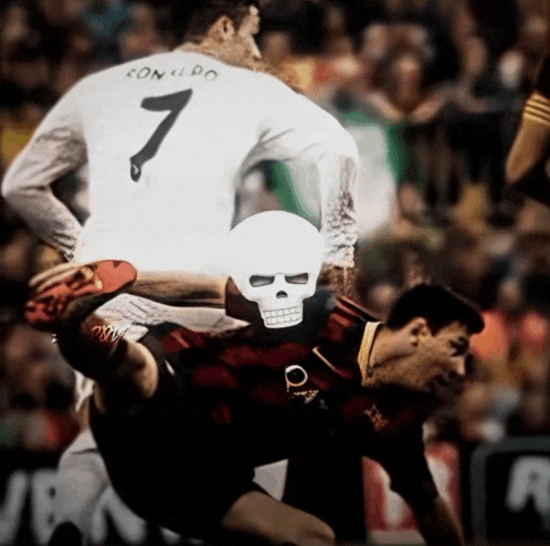 a soccer player with the number 7 on his back is being tackled by another player