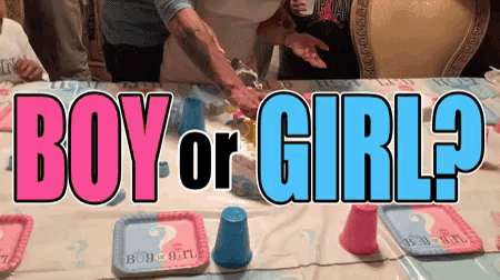 boy or girl written on a table with plates