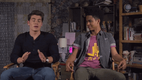 gregg sulkin and rhenzy feliz are sitting next to each other in a room