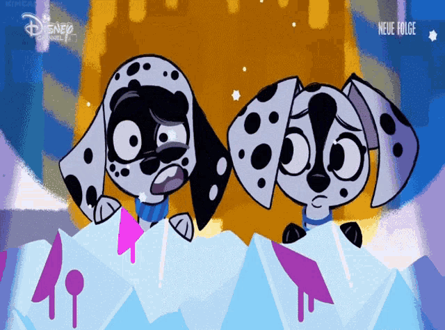 two dalmatian dogs standing next to each other with a disney channel logo in the corner
