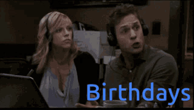 a man and a woman wearing headphones are looking at a laptop screen that says two birthdays on it