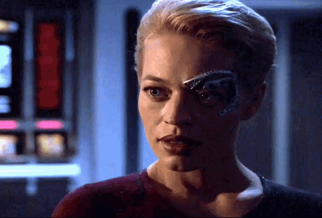 a close up of a woman with a robotic eye