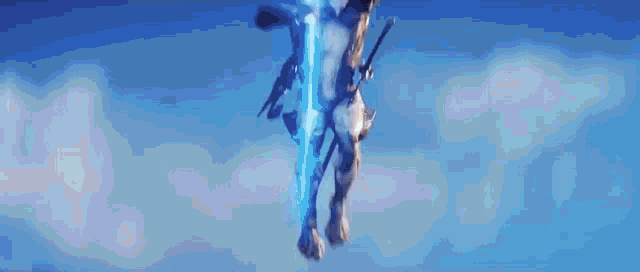 a statue of a man with a sword and a blue light coming out of his chest .