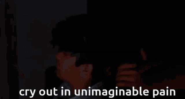 a person is crying in the dark with the words cry out in unimaginable pain below them