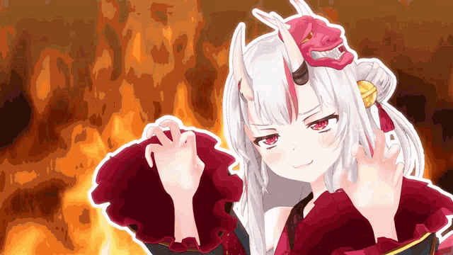 a girl with horns and a red mask on her head stands in front of a fire
