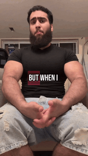 a man with a beard wears a shirt that says but when i