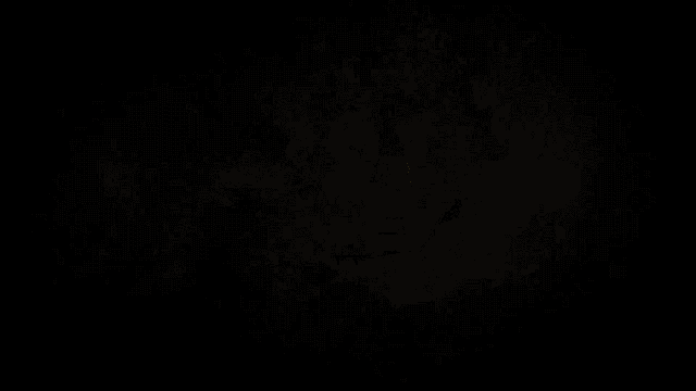 a dark background with a yellow light coming out of the middle