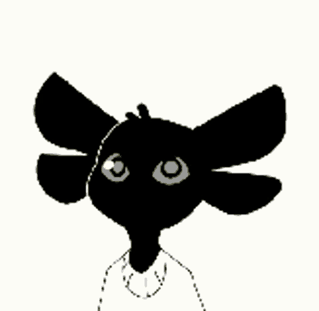a black cat with yellow eyes is being patted on the head by a person .