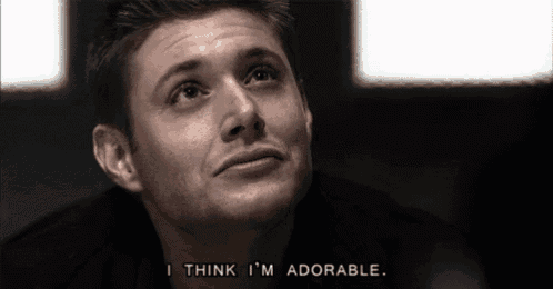 a man is saying i think i 'm adorable in a black and white photo .