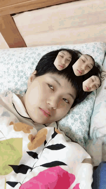 a person laying on a bed with their faces on their pillows