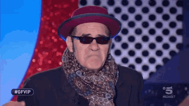 a man wearing sunglasses and a hat is on a tv show called gfvip
