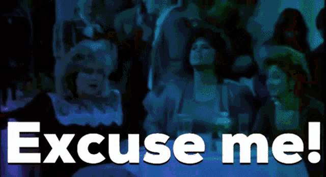 a woman in a green dress is dancing in front of a crowd and the words excuse me are above her