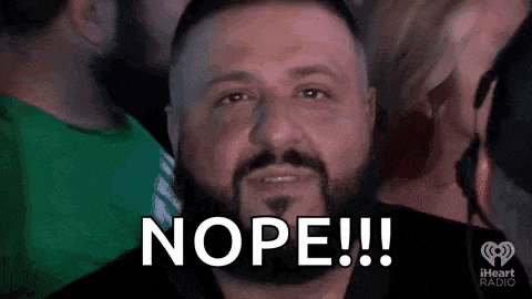 a man with a beard is making a funny face and saying nope !
