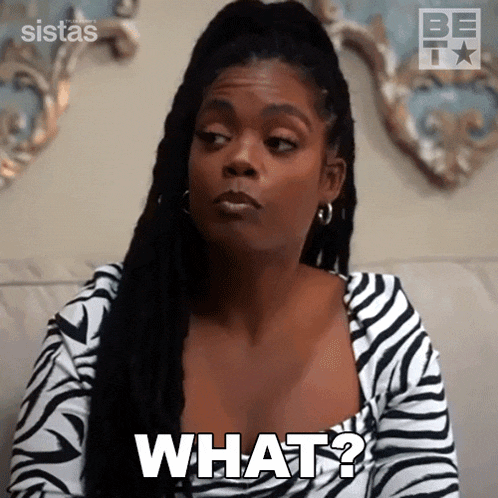 a woman in a zebra print dress is sitting on a couch and asking what ?