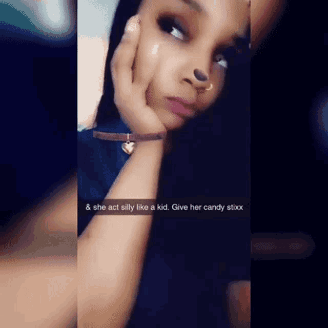 a woman is taking a selfie with a caption that says she act silly like a kid .