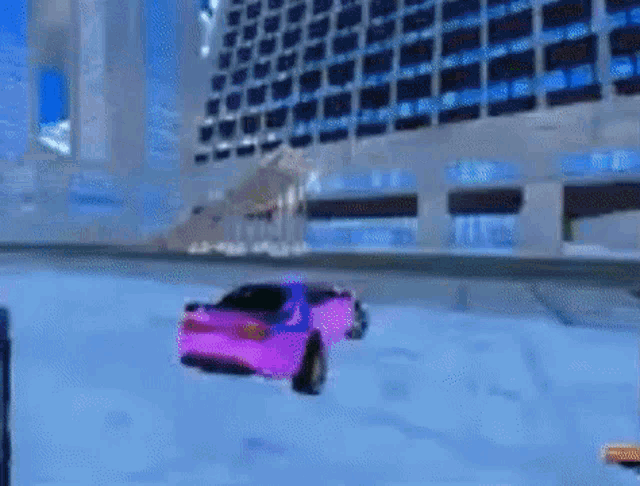 a purple car is driving down a street in front of a building in a video game .