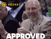 a man in a suit and tie is giving a thumbs up and the word approved is on the bottom