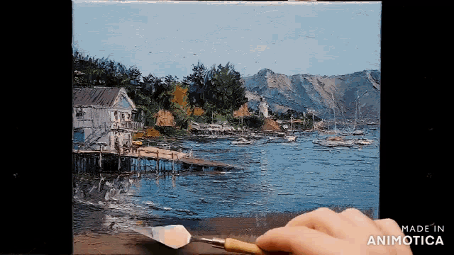 a person is painting a landscape with the words made in animatica on the bottom right