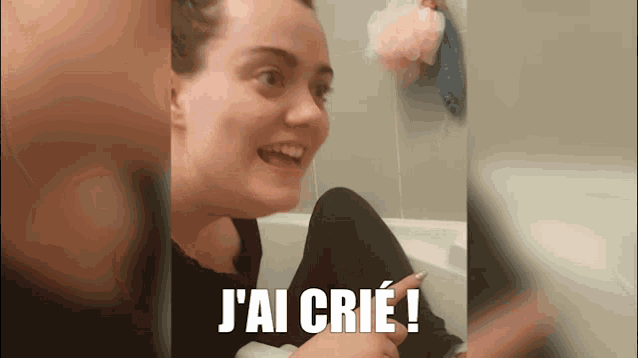 a woman sitting in a bathtub with the caption j'ai crie !