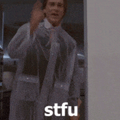 a man wearing a clear raincoat says stfu in white letters