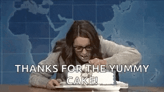 a woman is sitting at a table with a cake in front of her and says thanks for the yummy cake .