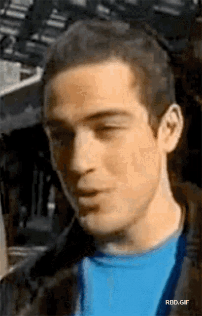a close up of a man 's face with the words rbd.gif below