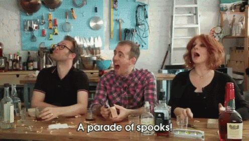 a group of people are sitting at a table with bottles of liquor and the words a parade of spooks