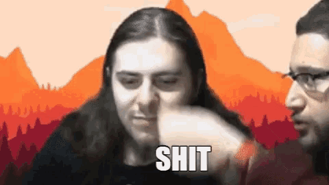 a man with long hair is blowing his nose while another man says the word shit .