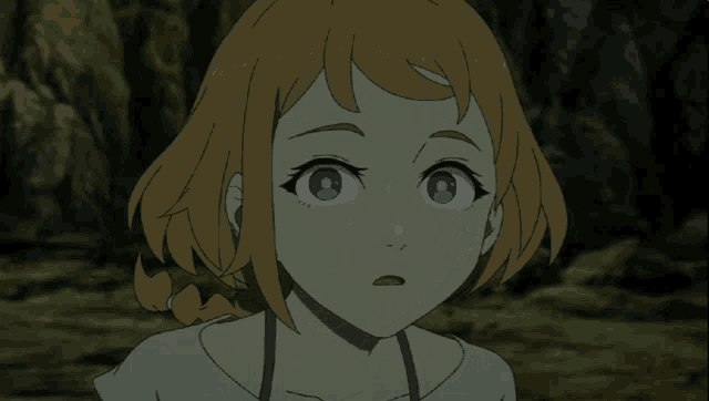 a close up of a girl 's face with a tear coming out of her eye