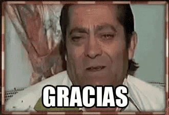 a man is laying in a bed with his eyes closed and the words `` gracias '' written on the screen .