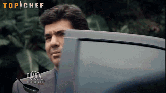 a man looking out of a car window with the words top chef on the bottom right