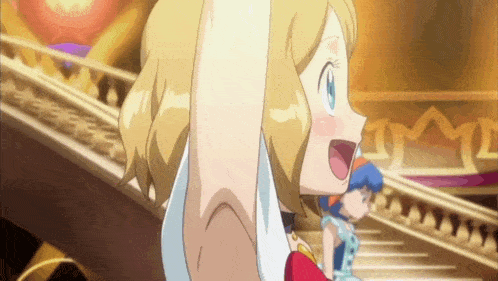 a girl with blonde hair is raising her arm in the air