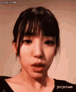 a close up of a woman 's face with the words honeycam visible