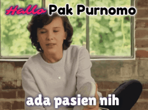 a woman sits in front of a window with the words " hallo pak purnomo ada pasien nih "