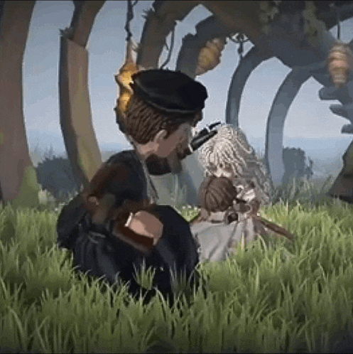 a man and a woman are sitting in the grass kissing .
