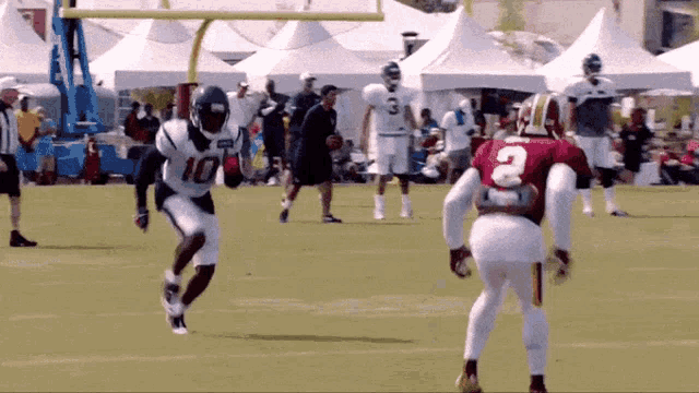a football player with the number 10 on his jersey is running