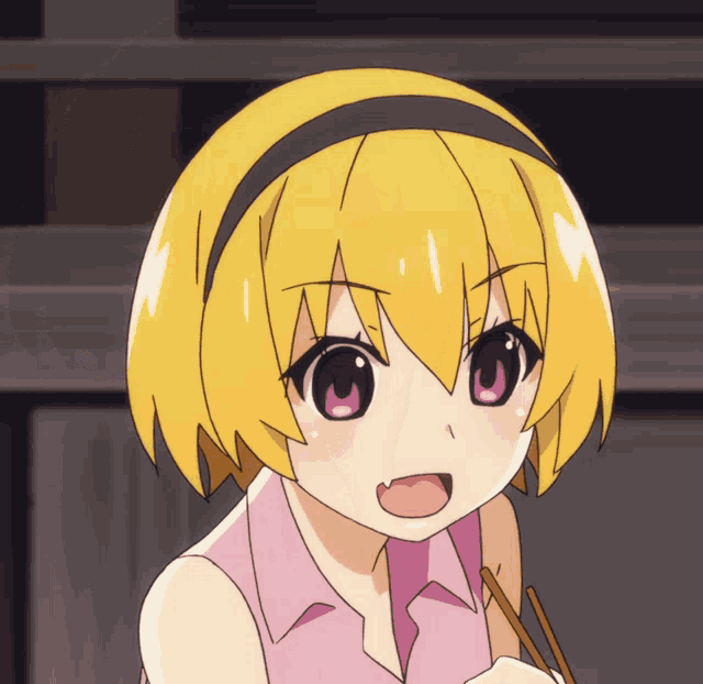a close up of a girl 's face with yellow hair