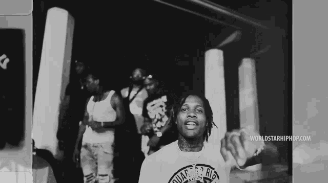 a black and white photo of a man with the words worldstarhiphop.com on the bottom right